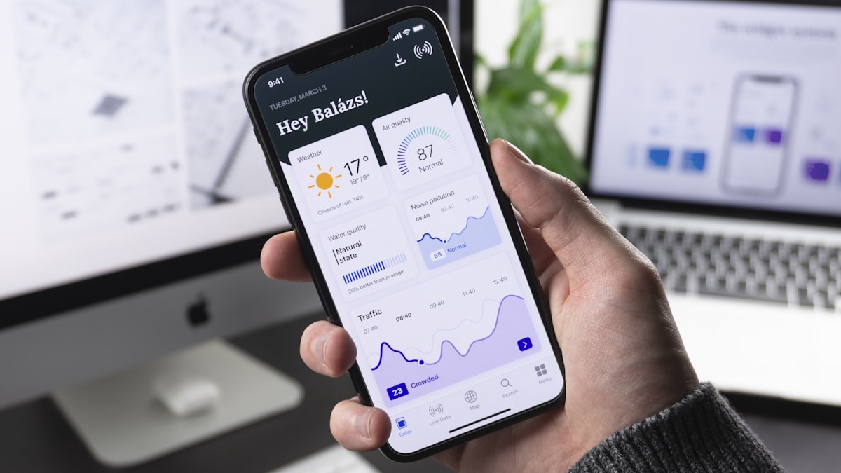 Person checking a mobile banking app for forgotten subscriptions