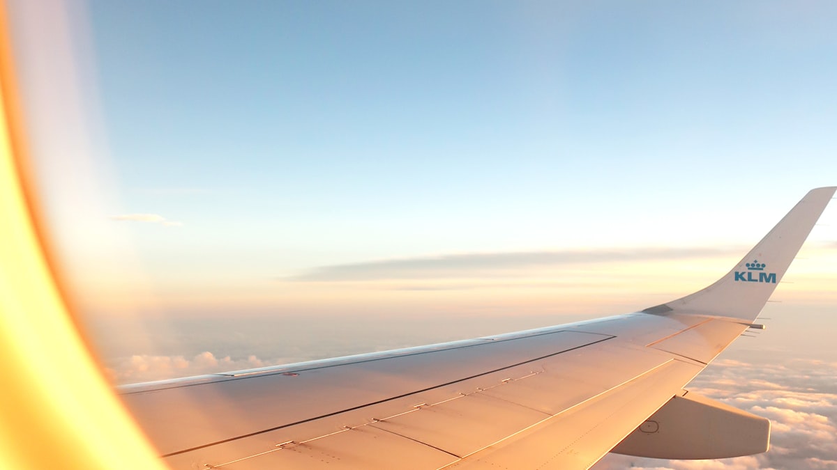 Airplane wing seen through a window during flight