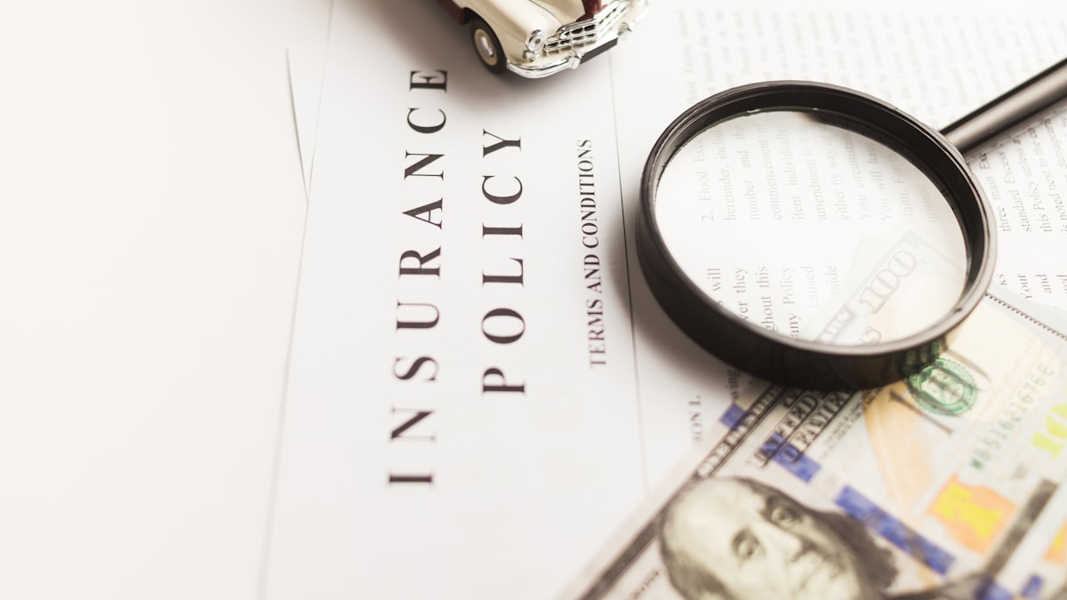 Insurance and financial documents representing credit card add-on fees