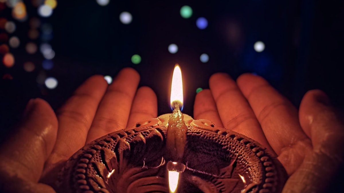 A diya oil lamp lit for Diwali festival celebrations