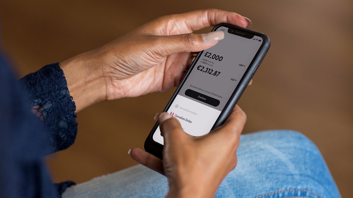 Smartphone showing a bank auto-debit notification alert