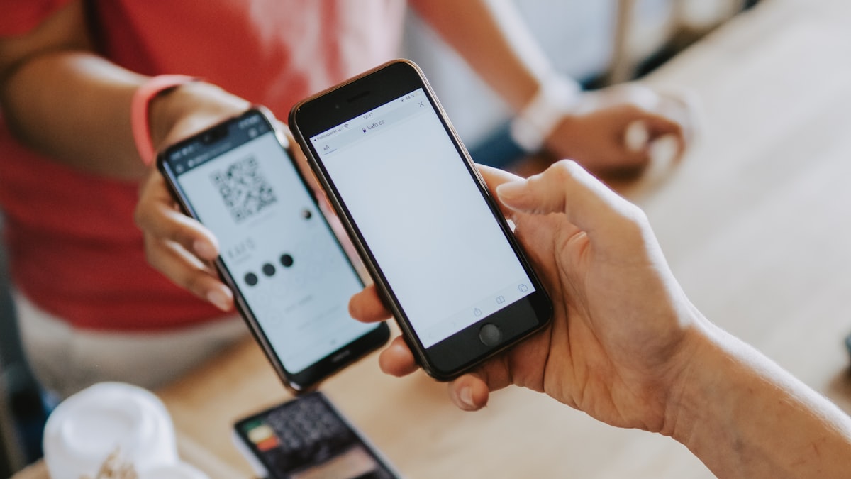 Smartphone scanning a UPI QR code for payment