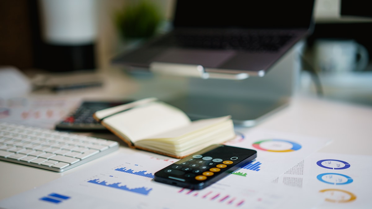 Calculator and budget charts on a desk