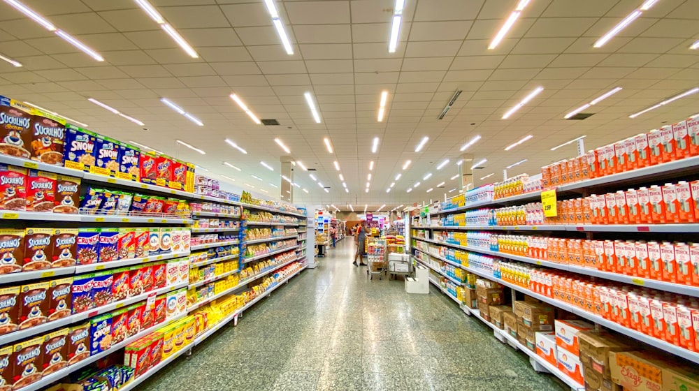 A grocery store aisle stocked with everyday products